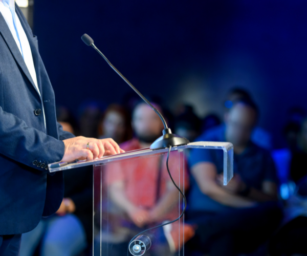 Presenter on stage at convention