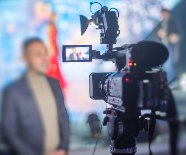 journalist speaking before camera on tv